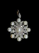 An early 20th century gold and silver, pearl and diamond set cluster pendantof shaped square form,