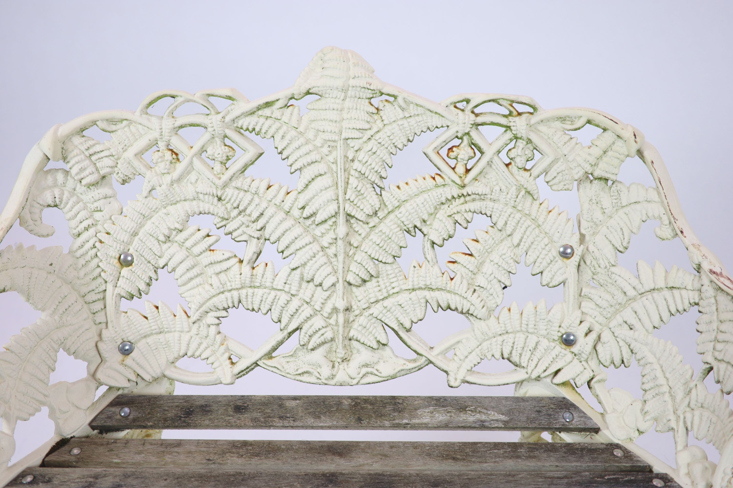A Victorian cast iron Coalbrookdale 'Fern' pattern garden benchpainted white, with wooden slats to - Image 3 of 5