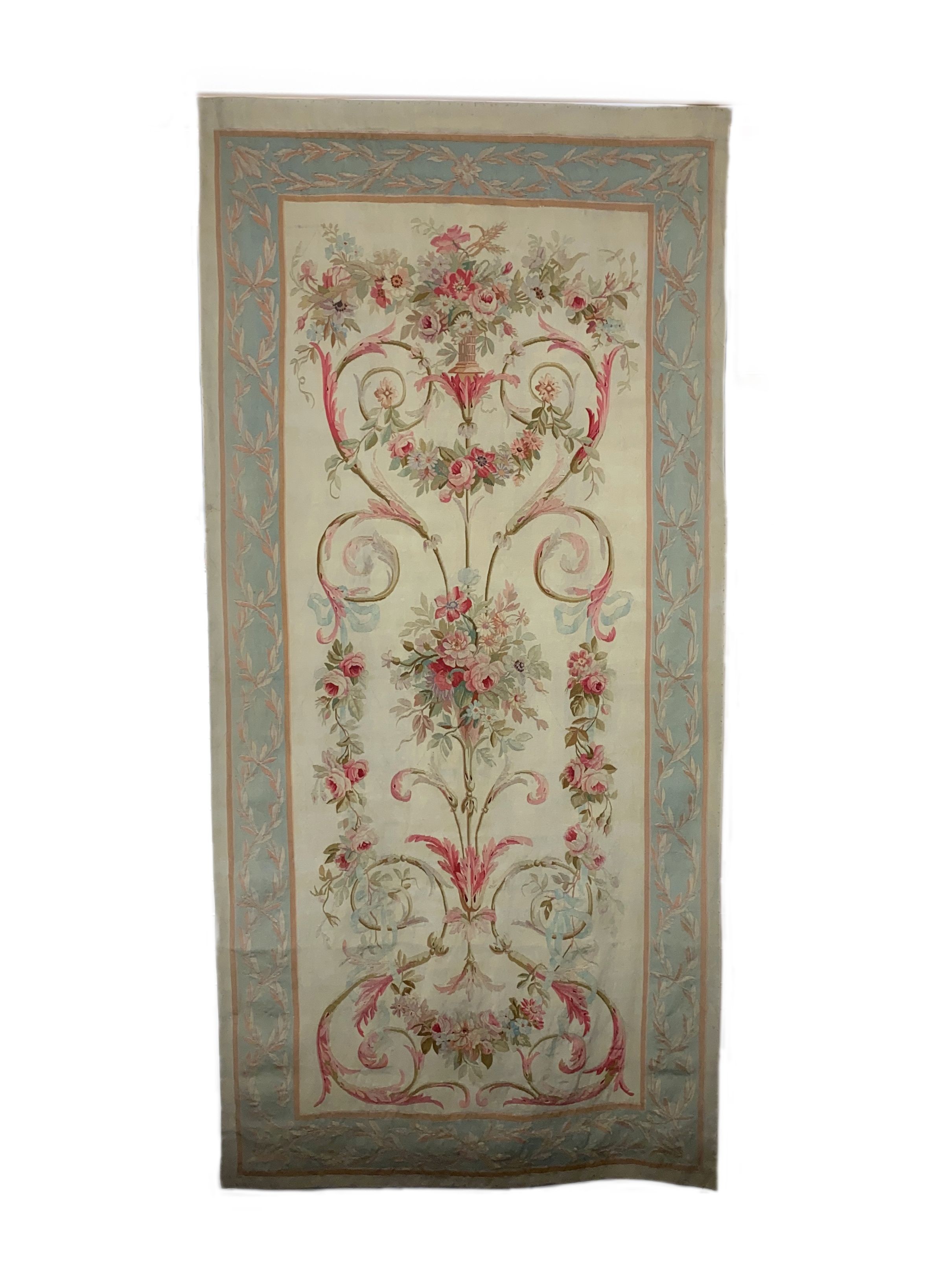 A large 19th century Aubusson entre fenetre tapestry wall panel,woven with a vase of flowers