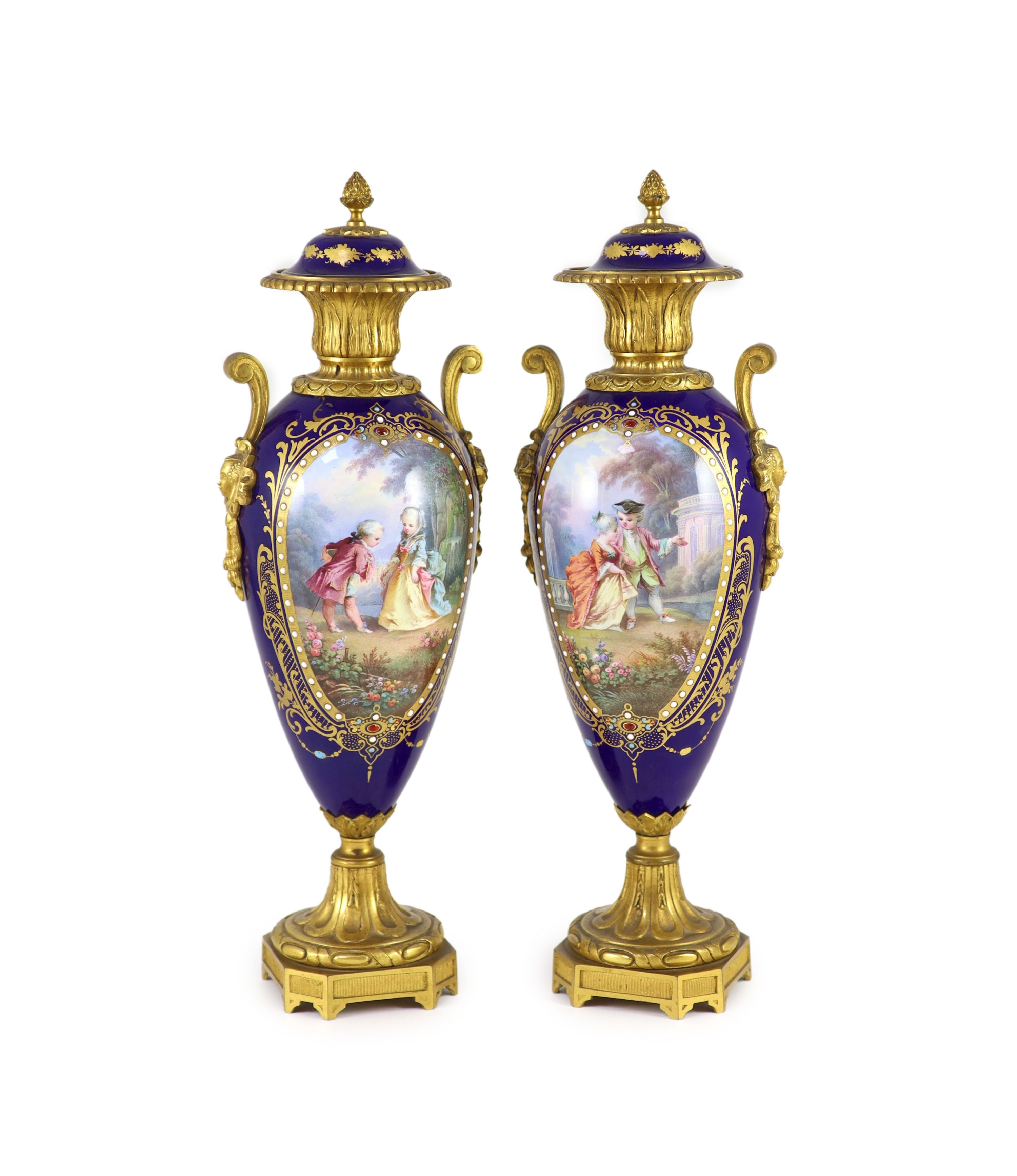 A pair of Sevres style ‘jewelled’ porcelain and ormolu mounted vases, c.1900,each of oviform,