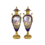 A pair of Sevres style ‘jewelled’ porcelain and ormolu mounted vases, c.1900,each of oviform,