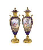 A pair of Sevres style ‘jewelled’ porcelain and ormolu mounted vases, c.1900,each of oviform,