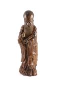 A tall Chinese rootwood figure of Shou Lao, 17th/18th century,the standing figure holding a scroll