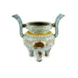 A Chinese Canton enamel tripod censer, Qianlong mark and period (1736-95),finely painted with pale