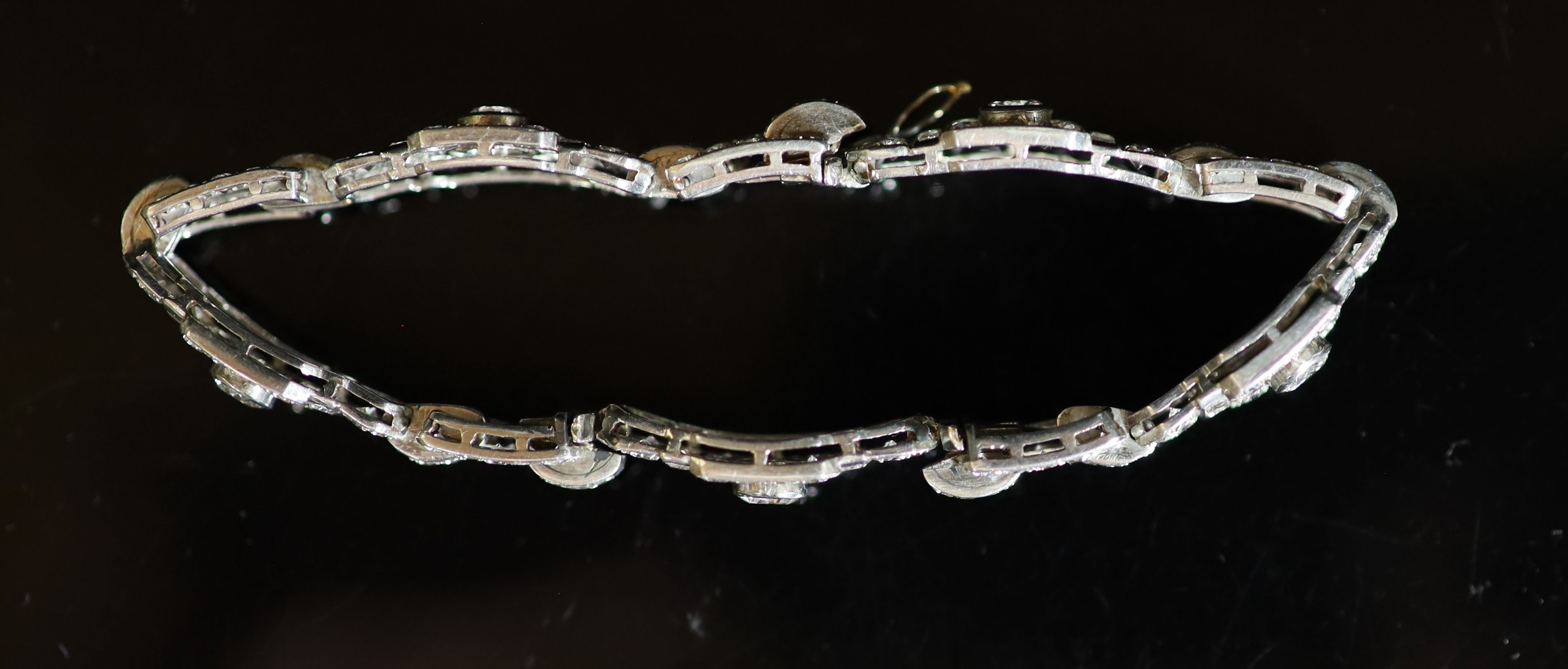 A mid 20th century platinum and diamond encrusted rectangular link bracelet,set with round and - Image 2 of 4