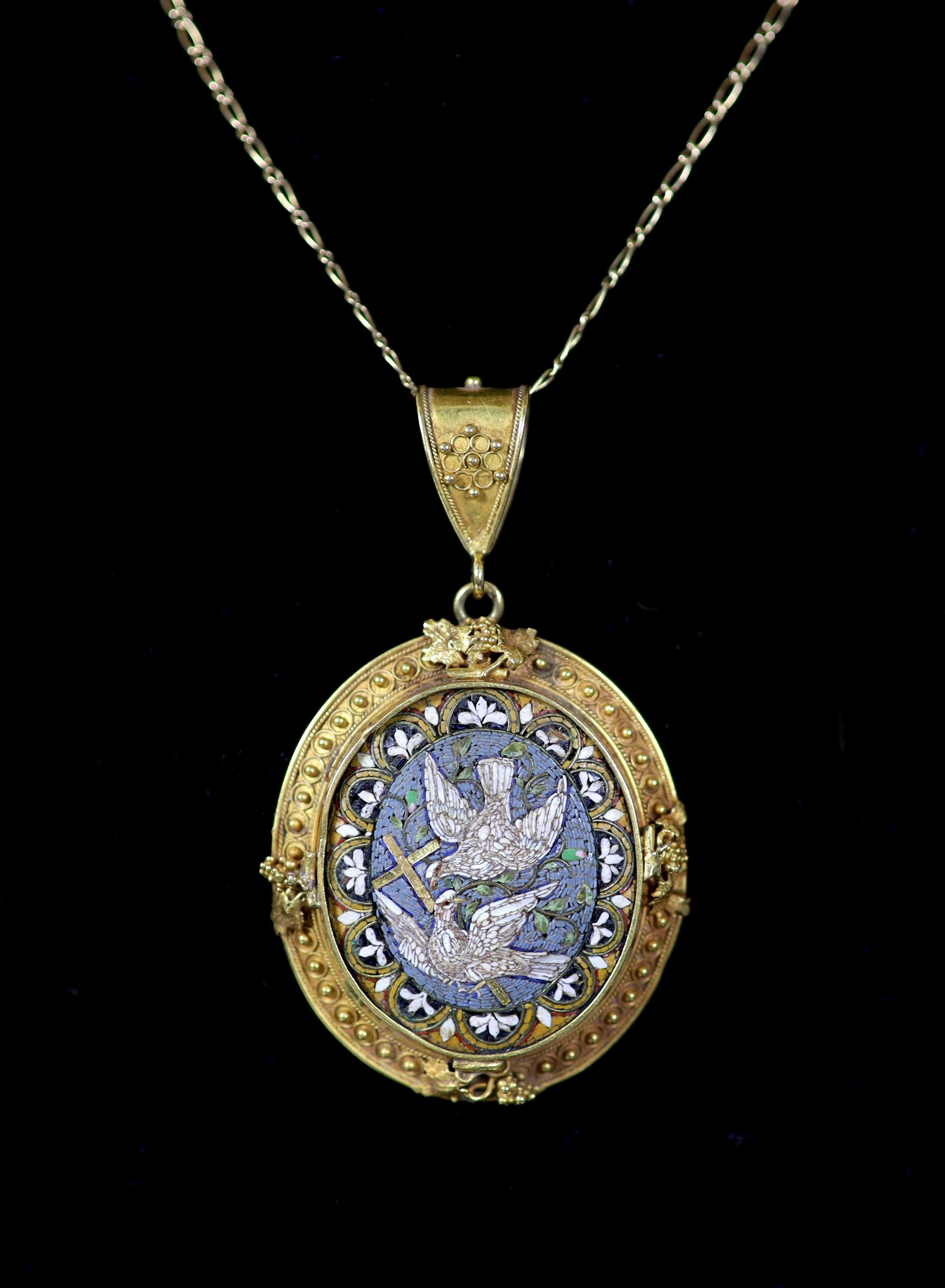 A 19th century gold and micro mosaic set oval pendant, decorated with Doves of Peace,the border