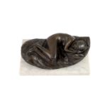 § James W. Butler. RA., A bronze model of a sleeping girl,signed in the bronze and dated '77, on