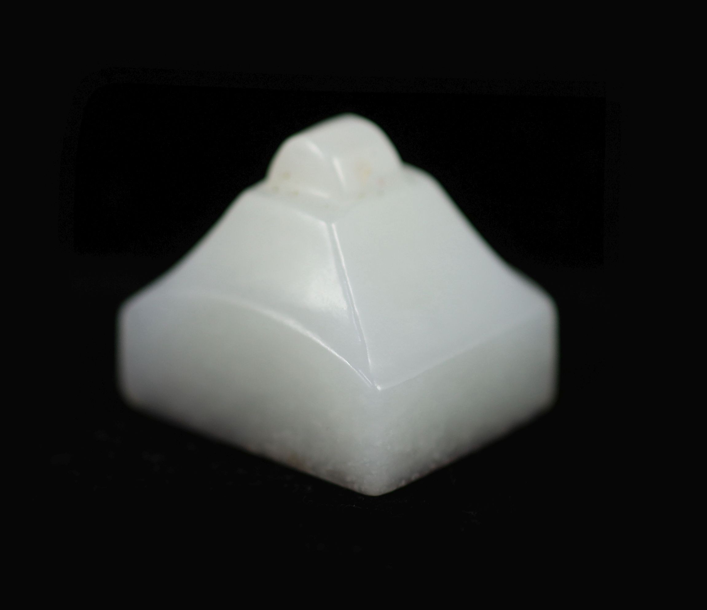 A Chinese white jade rectangular seal,the matrix carved with four characters, the stone of good even