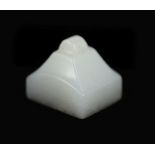 A Chinese white jade rectangular seal,the matrix carved with four characters, the stone of good even