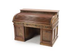 A late 19th century American walnut and mahogany 'Wootton' desk,with tambour over three frieze