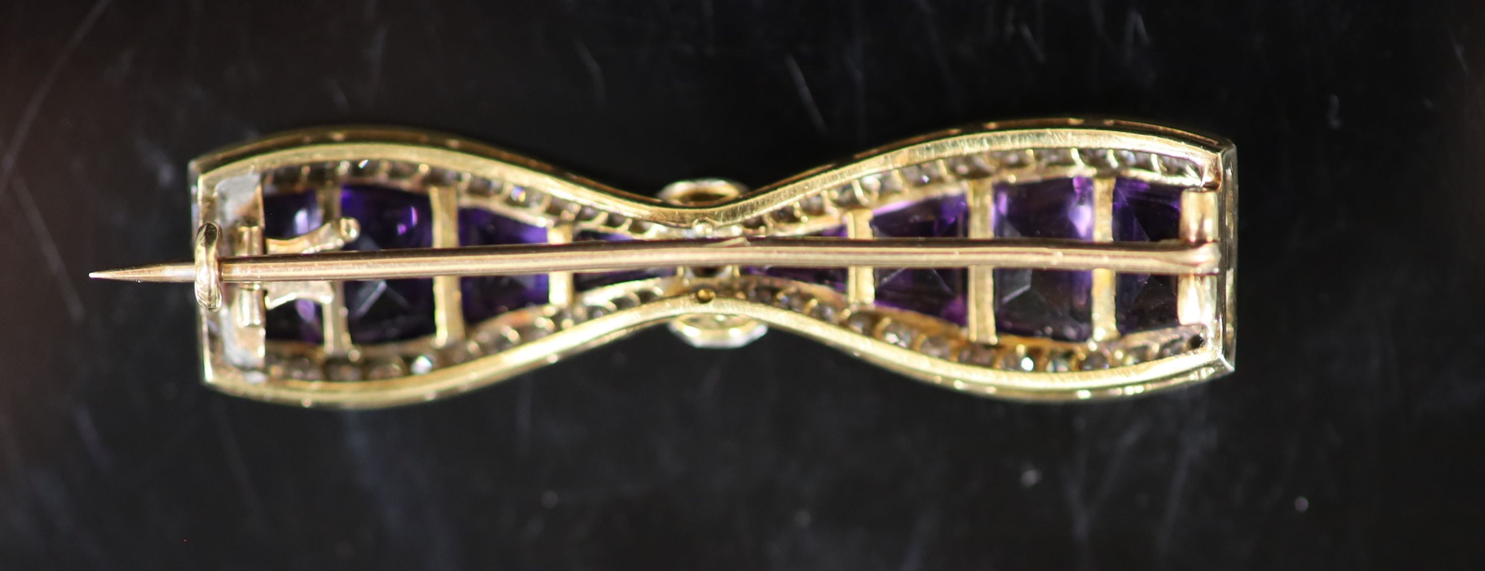 A 20th century gold and platinum, amethyst and millegrain diamond set 'bow tie' brooch,set with - Image 2 of 2