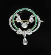 A 1920's gold and platinum, emerald and diamond set open work drop brooch,with square cut emeralds
