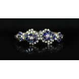 A 18ct white gold sapphire and diamond set double cluster bracelet,with sapphire and diamond set