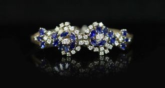 A 18ct white gold sapphire and diamond set double cluster bracelet,with sapphire and diamond set
