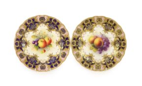 A pair of Royal Worcester fruit painted dessert plates, signed A. Shuck, c.1918 and 1935,each within