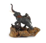 A good Japanese bronze elephant and tiger group, Meiji period signed Seiya saku,modelled as two