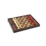 An early 20th century rosewood folding games board, external chess and internal backgammon,fitted