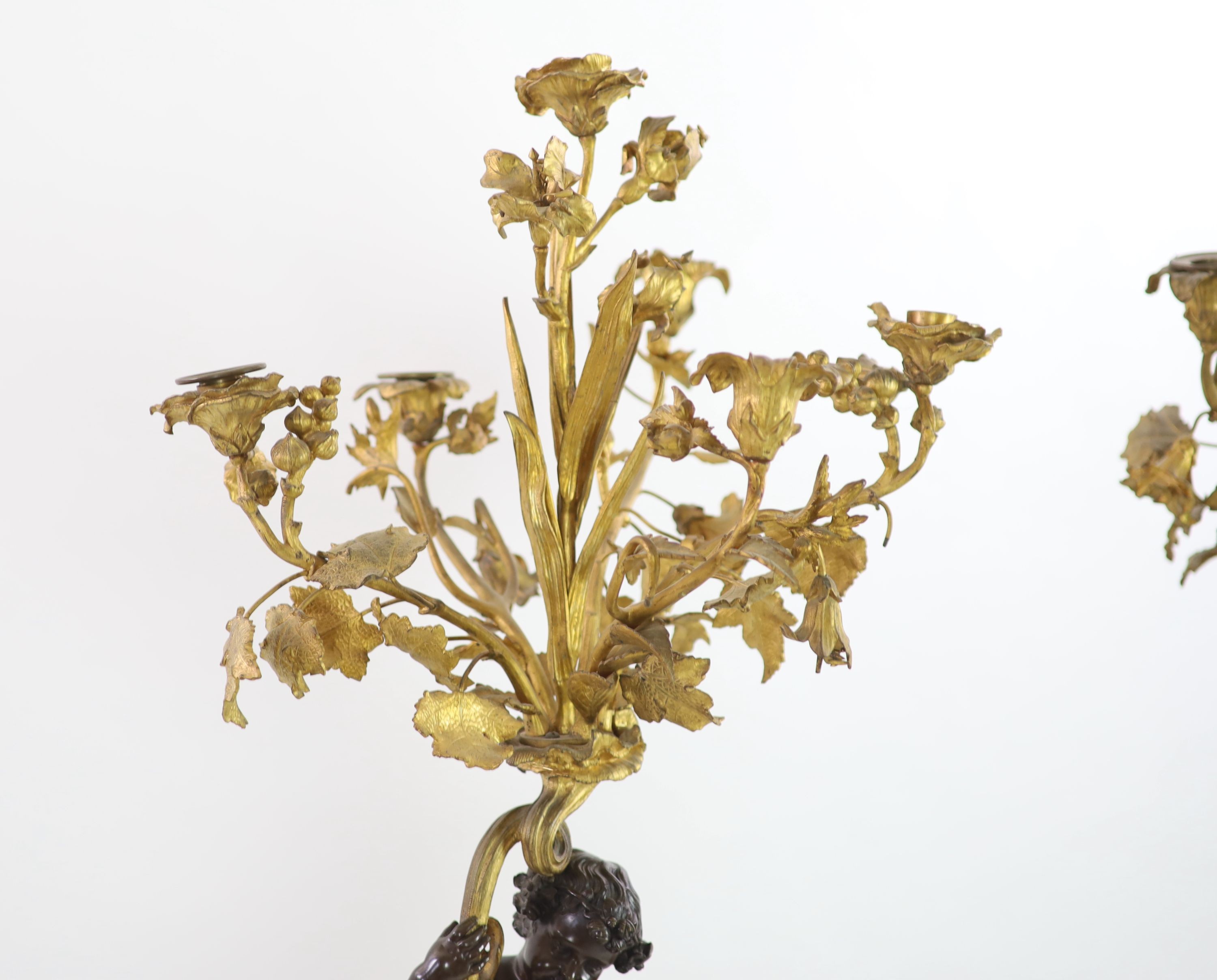 A pair of 19th century French bronze and ormolu six light candelabra,modelled as putti supporting - Image 4 of 6