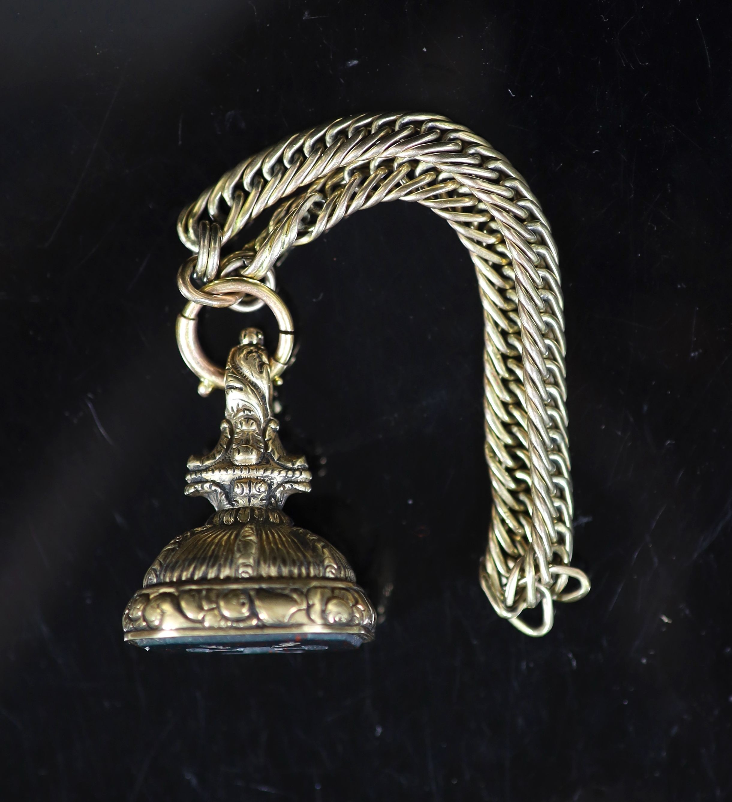 A 19th century gold overlaid and bloodstone set fob seal, the matrix carved with two arms grasping a - Image 2 of 3