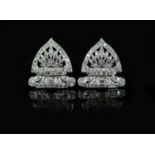 A pair of 1960's pierced platinum and diamond fan shaped ear clips,set with small round and baguette