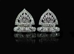 A pair of 1960's pierced platinum and diamond fan shaped ear clips,set with small round and baguette