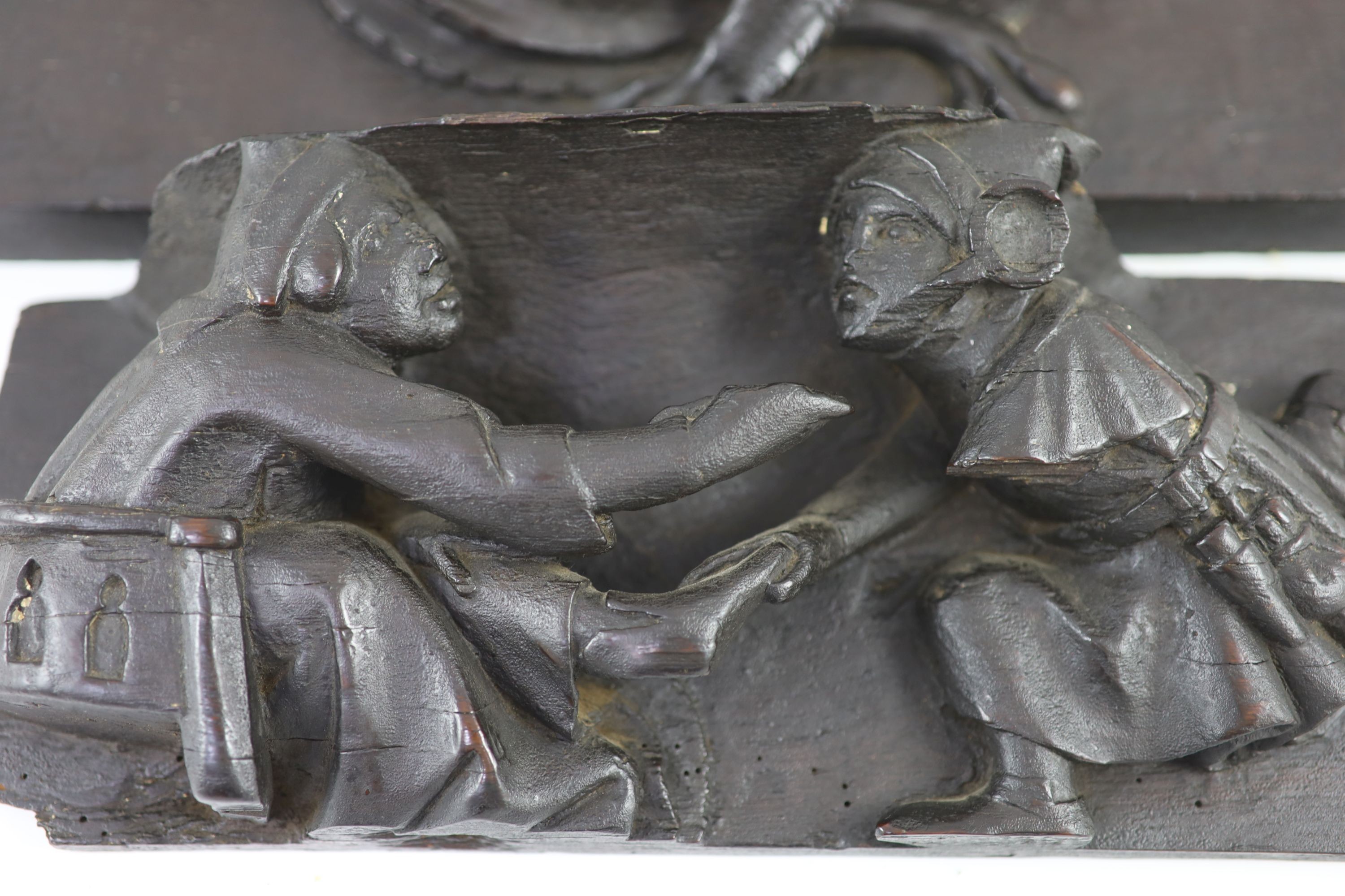 Two carved oak misericord panel fragments, 15th/16th century,the largest carved with as a beast with - Image 3 of 4