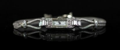 A lady's 1930's French Boucheron platinum and diamond set cocktail watch,and numbered 6823, with