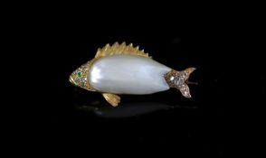 A gold, baroque pearl, garnet and diamond set brooch, modelled as a fish,31mm, gross weight 5