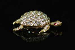 A mid to late 20th century French 18kt gold and pave set diamond clip brooch, modelled as a turtle,