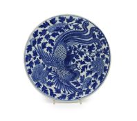 A Chinese blue and white ‘phoenix’ dish, Daoguang mark and period (1821-50),painted with a phoenix