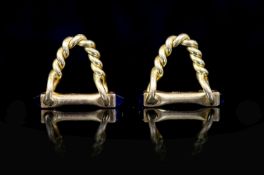 A pair of French Cartier 18ct gold and sapphire set cufflinks,of rope twist hoop design, one with