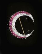 A late Victorian gold, graduated diamond and graduated cabochon ruby set two row crescent brooch,