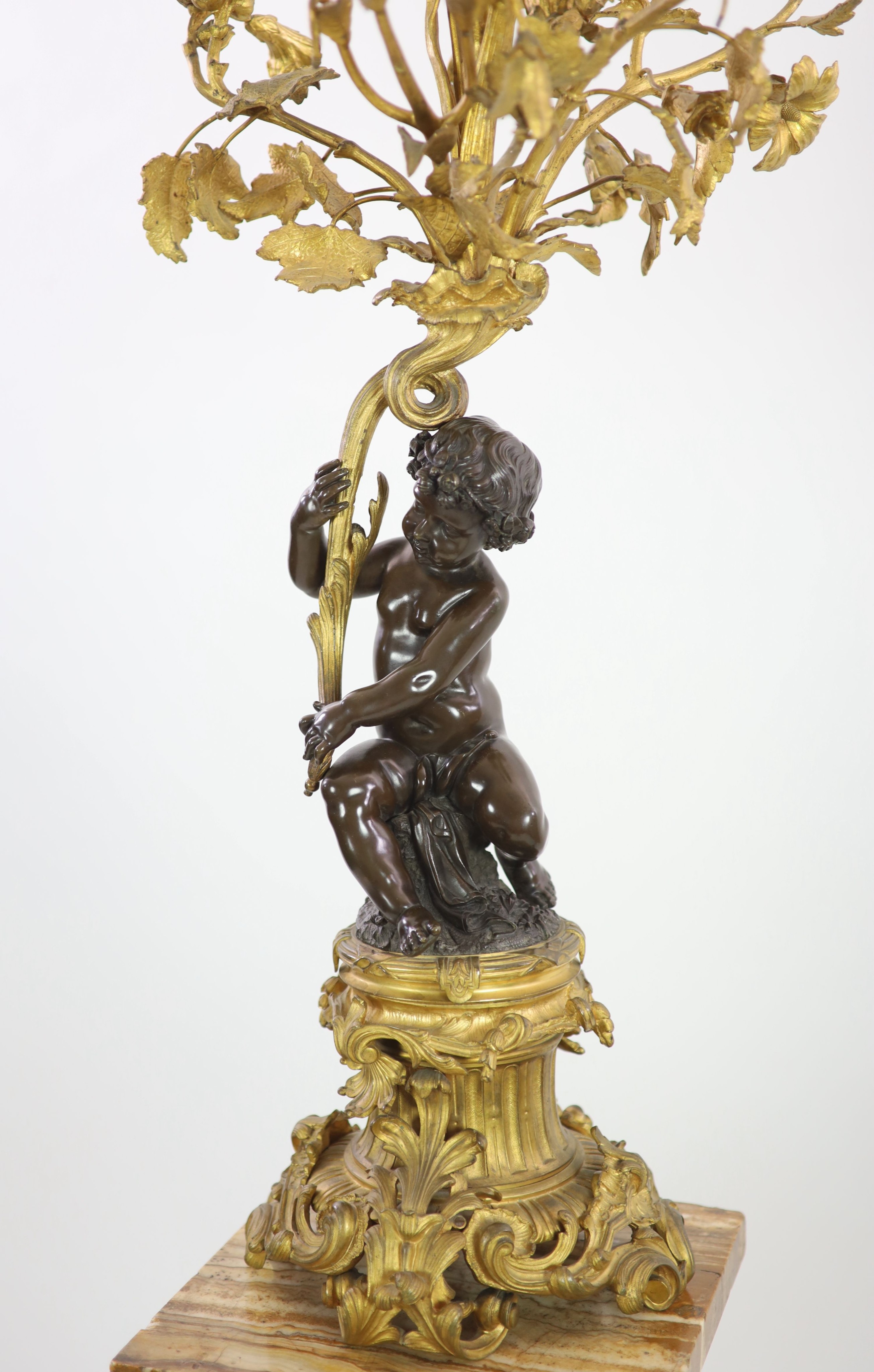 A pair of 19th century French bronze and ormolu six light candelabra,modelled as putti supporting - Image 2 of 6