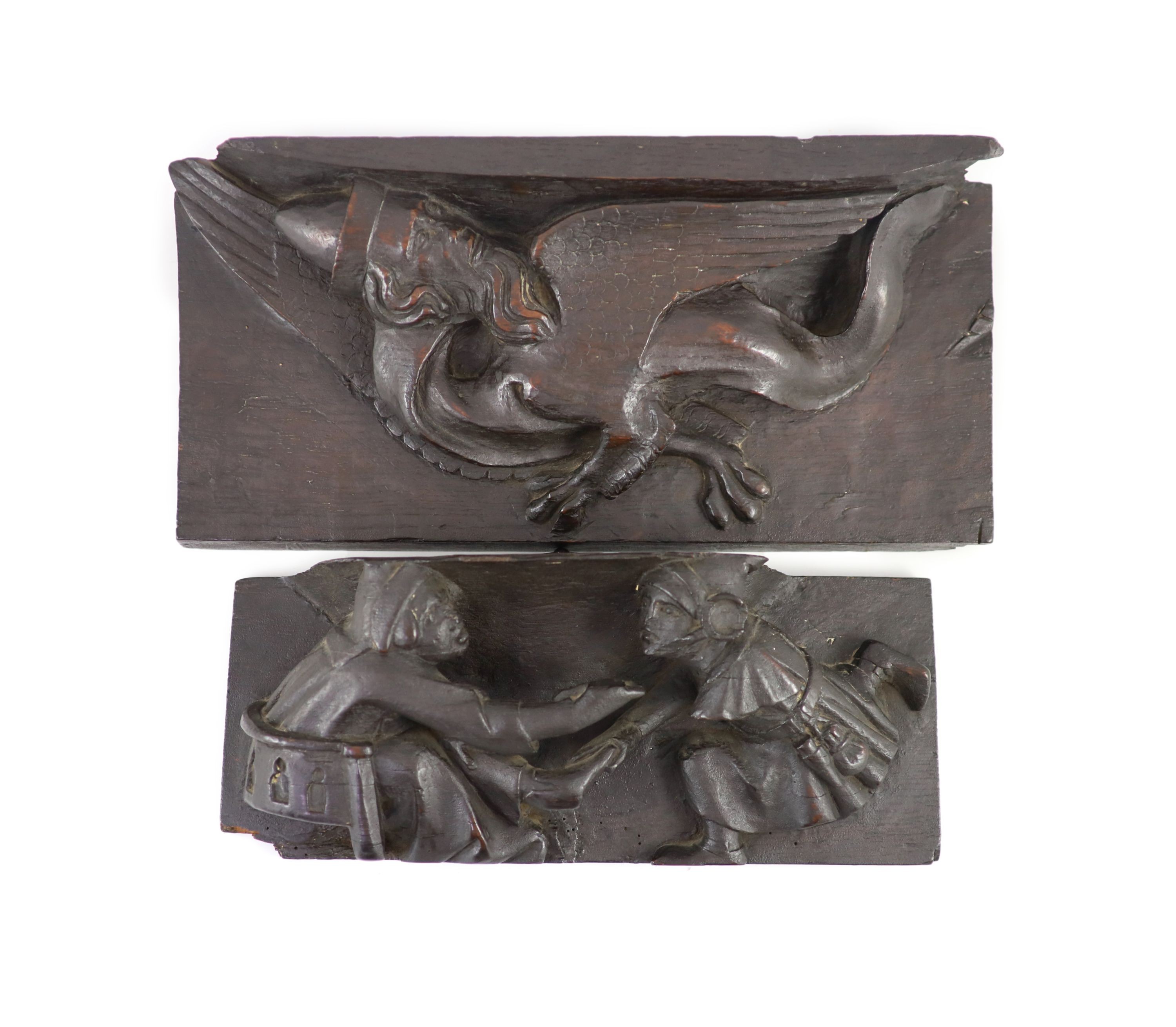 Two carved oak misericord panel fragments, 15th/16th century,the largest carved with as a beast with