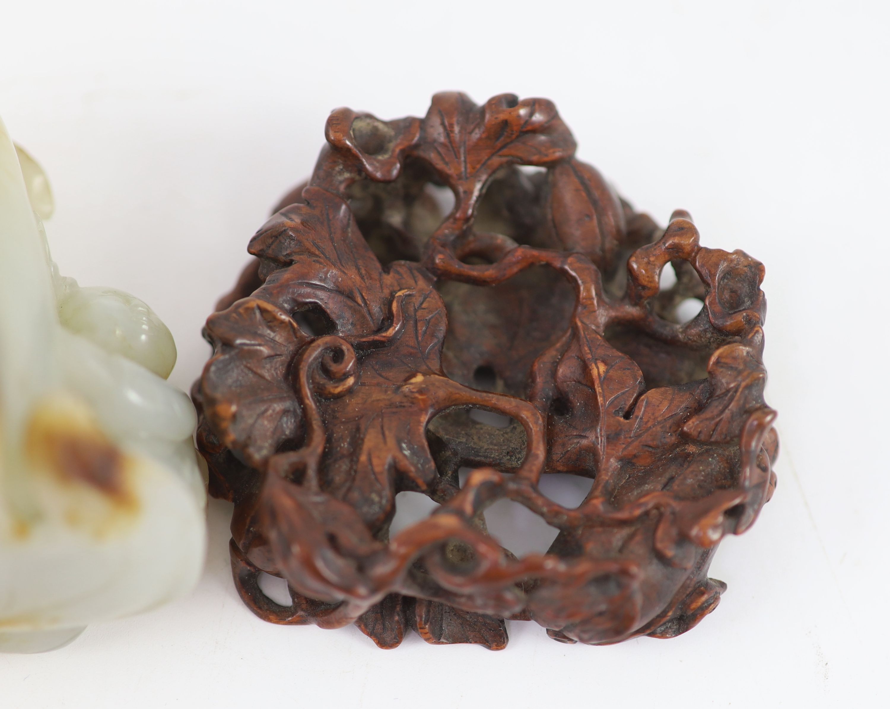 A Chinese pale celadon and russet jade 'boy' jar and cover,carved in openwork and high relief with a - Image 4 of 4