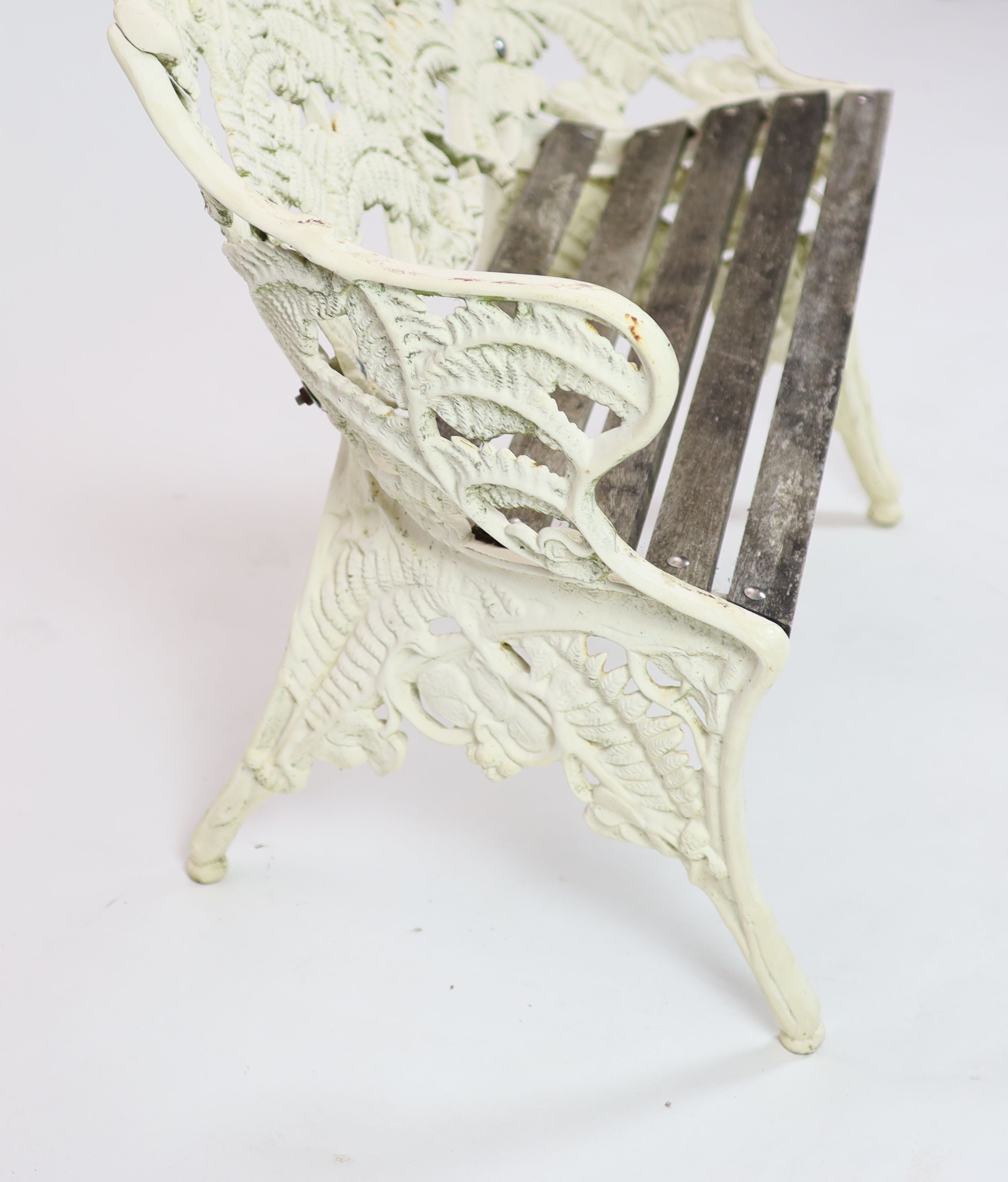 A Victorian cast iron Coalbrookdale 'Fern' pattern garden benchpainted white, with wooden slats to - Image 5 of 5