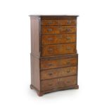 A George I crossbanded burr walnut chest on chestwith moulded cornice, two short and three graduated