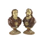 A pair of early 19th century Spanish carved and painted busts of saints,with parcel gilt