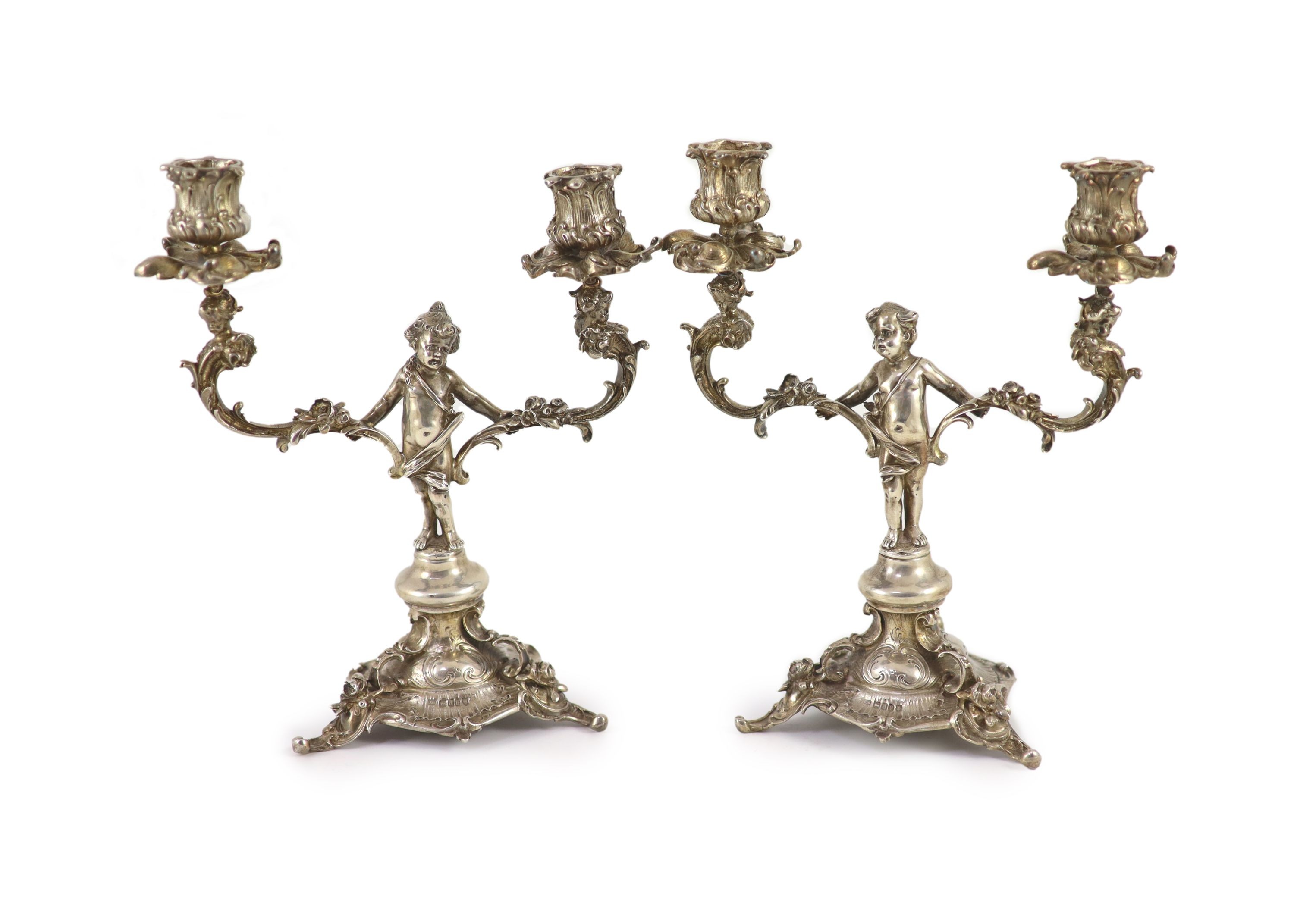 A pair of late Victorian silver two light, two branch candelabra,with figural stems, caryatid