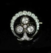 A late Victorian gold, silver and diamond cluster set 'crescent and clover' circular brooch,the