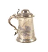 An early George III silver tankard, by John Moore,with hinged domed cover, banded girdle and open