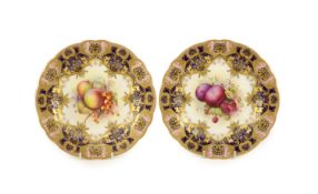 A pair of Royal Worcester fruit painted dessert plates, signed E. Phillips, c.1918,each within