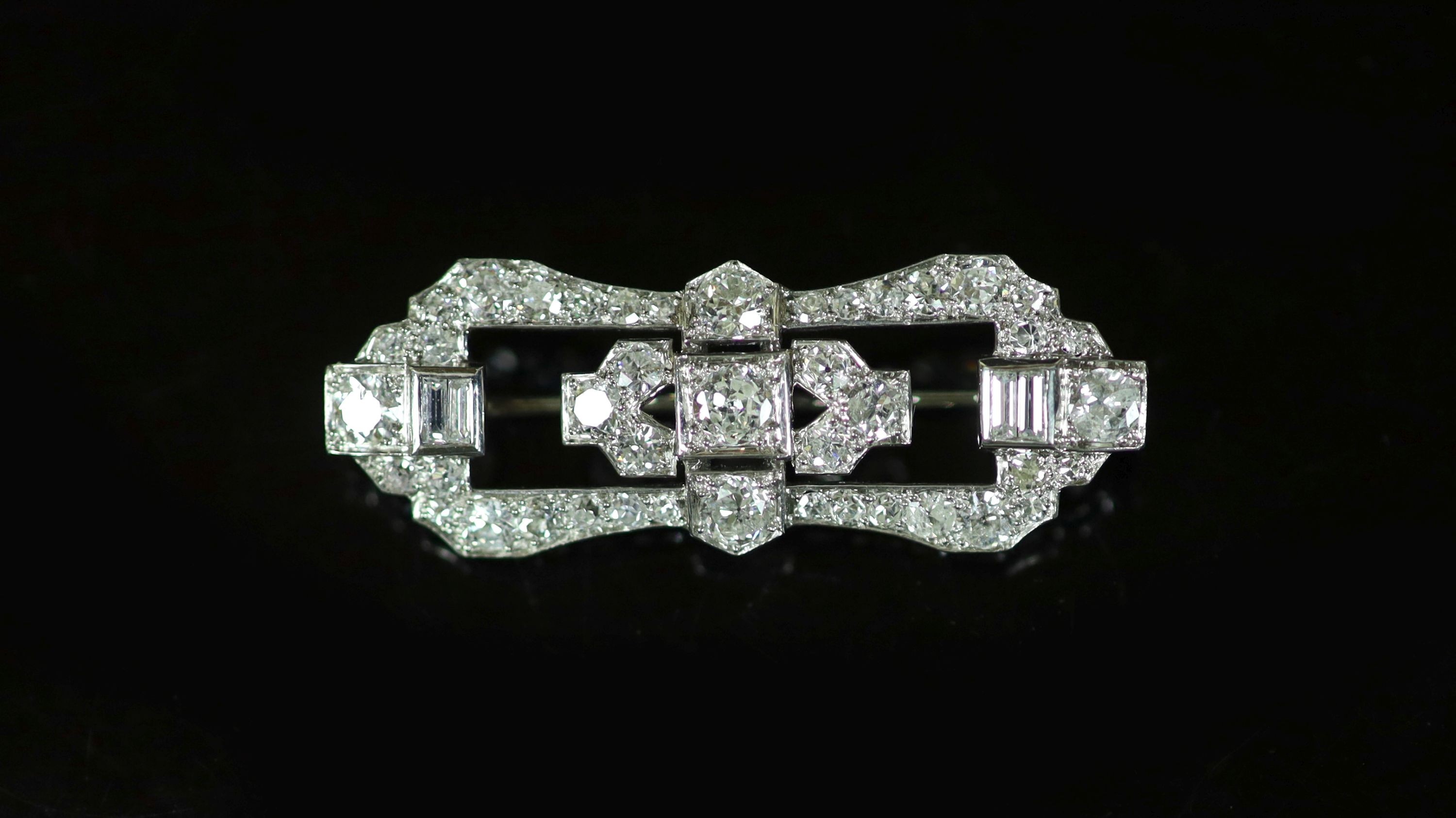 A 1940's/1950's platinum and diamond cluster set open work brooch,of waisted shaped oval form and