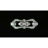 A 1940's/1950's platinum and diamond cluster set open work brooch,of waisted shaped oval form and