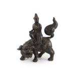 A large Chinese/Japanese bronze censer modelled as Wenshu riding a lion-dog, 17th/18th centurywith
