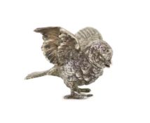 A late 19th/early 20th century Hanau novelty silver pepperette, modelled as a chick with outspread