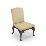 A George II mahogany side chairwith upholstered back and seat, blind fret carved apron and foliate