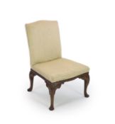 A George II mahogany side chairwith upholstered back and seat, blind fret carved apron and foliate