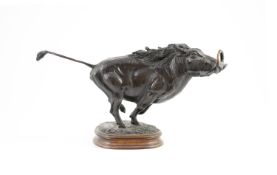 Tim Nicklin. A bronze model of a running warthogupon naturalistic base, signed and dated 1989, 2/10,