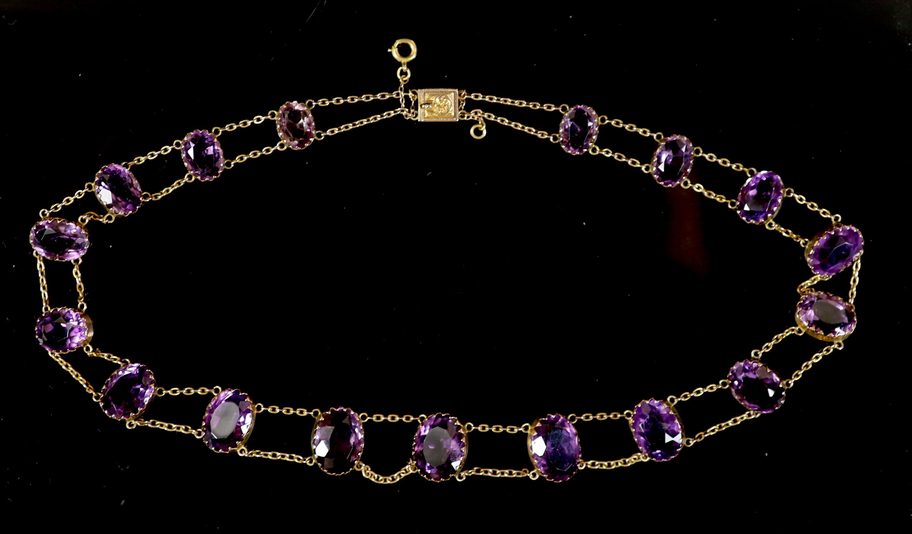 An Edwardian 9ct gold and graduated oval cut amethyst riviere necklace,set with seventeen stones, - Image 2 of 3